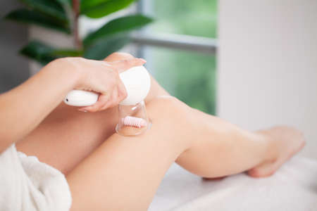 Woman getting LPG massage for skin care in beauty studio.の写真素材