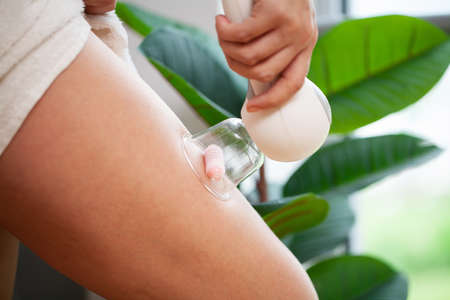 Woman getting LPG massage for skin care in beauty studio.の写真素材