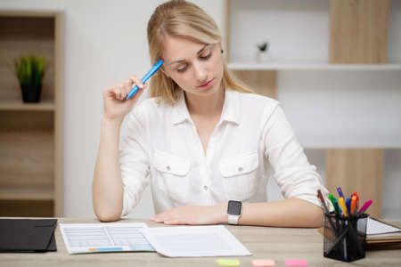 Beautiful young woman working in the officeの写真素材