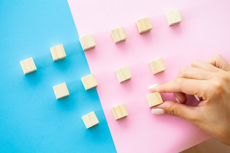 Hand putting and stacking blank wooden cubes on table with copy space for input wording and...