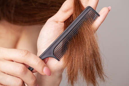 Woman with a comb in her hand on dressing room.