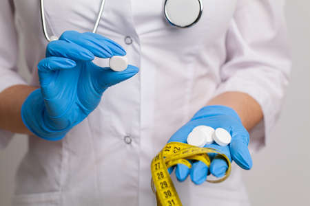 Picture of doctor hand showing one capsuleの写真素材