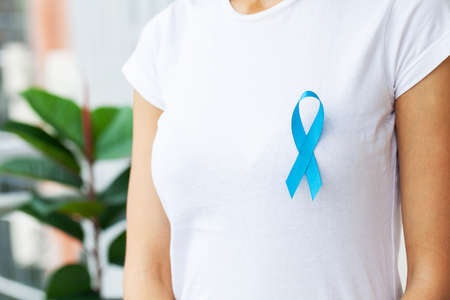 Woman with blue ribbon, prostate cancer awarenessの写真素材