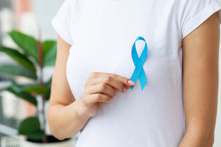 Doctor with blue ribbon, prostate cancer awarenessの写真素材
