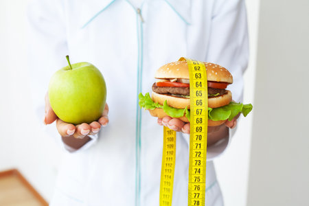 Choose between junk food versus healthy dietの写真素材