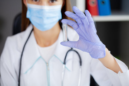 Doctor holding test tube for 2019-nCoV analyzing.の写真素材