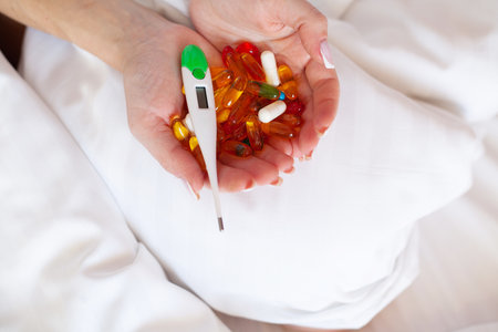 Many pills and capsules in women in the handsの写真素材