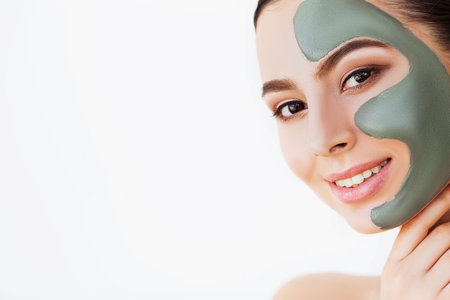 Female face with perfect skin and gray spa mask.の写真素材