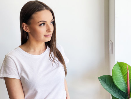 Portrait of a beautiful woman wearing a white T-shirt.の写真素材