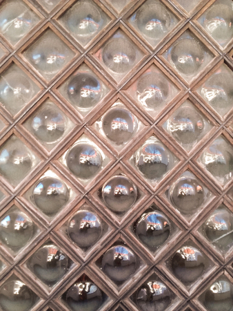 Ancient glass blocks window with wooden frameの写真素材