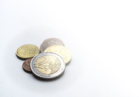 Several euro coins on light blurred background. Two euro. Closeup photoの写真素材