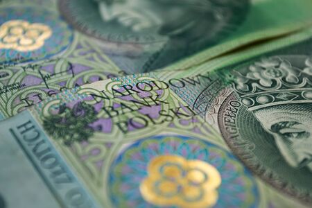 Polish zloty banknotes background. One hundred zloty banknotes. Macro photoshot. Narodowy Bank Polskiの写真素材