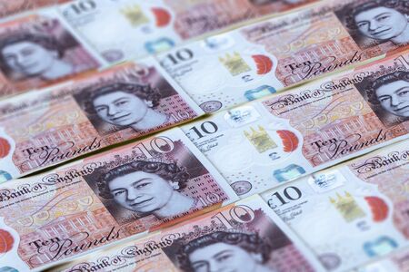 UK pounds banknotes background. Money of United Kingdom. 10 poundsの写真素材