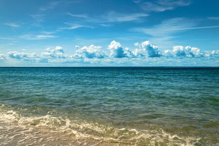 Beautiful tropical  sea with blue cloudy sky. Tropical summer background. Calm seaの写真素材