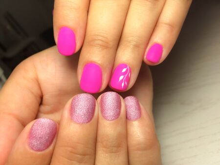Nails care. Woman hands with pink manicure. Closeup photo. Beauty, healthcareの写真素材