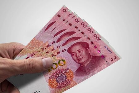 Hand holding Chinese Renminbi. RMB. Currency of China.の写真素材