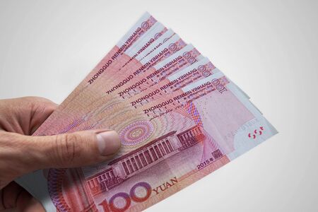 Hand holding Chinese Renminbi. RMB. Currency of China.の写真素材