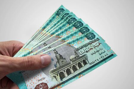 Hand holding Egyptian Pounds. EGP. Currency of Egypt.の写真素材