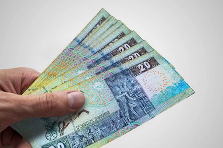Hand holding Egyptian Pounds. EGP. Currency of Egypt.の写真素材