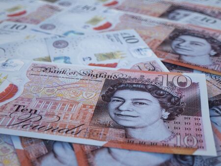 GBP. British Pounds macro background. Money of United Kingdom. Londonのeditorial素材