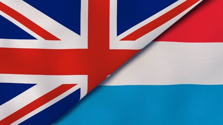 Two states flags of United Kingdom and Luxembourg. High quality business background. 3d illustrationの写真素材