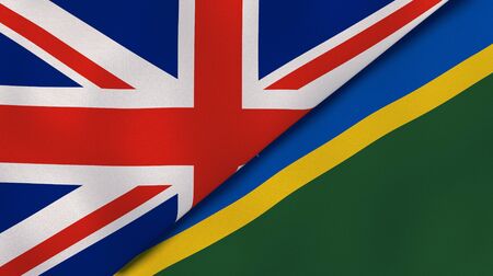 Two states flags of United Kingdom and Solomon Islands. High quality business background. 3d illustrationの写真素材