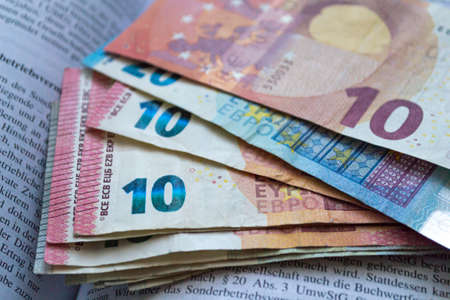 Euro banknotes background. Money of European Union on the German accountant book. Macro photoの写真素材