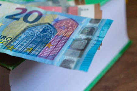 Euro banknotes background. Money of European Union on the German accountant book. Macro photoの写真素材