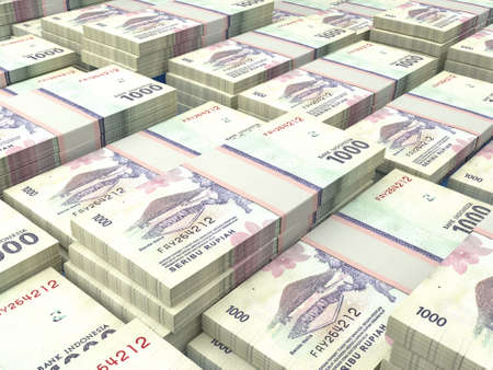 Money of Indonesia. Indonesian rupiah bills. IDR banknotes. 1000 rupiahs. Business, finance, news background.の写真素材