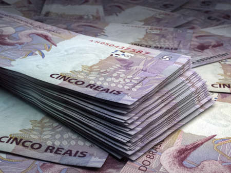 Money of Brazil. Brazilian real bills. BRL banknotes. 5 reals. Business, finance, news background.の写真素材