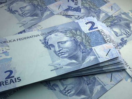 Money of Brazil. Brazilian real bills. BRL banknotes. 2 reals. Business, finance, news background.の写真素材