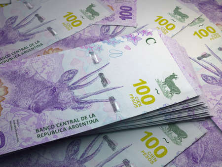 Money of Argentina. Argentine peso bills. ARS banknotes. 100 pesos. Business, finance, news background.の写真素材