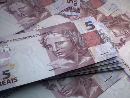 Money of Brazil. Brazilian real bills. BRL banknotes. 5 reals. Business, finance, news background.の写真素材