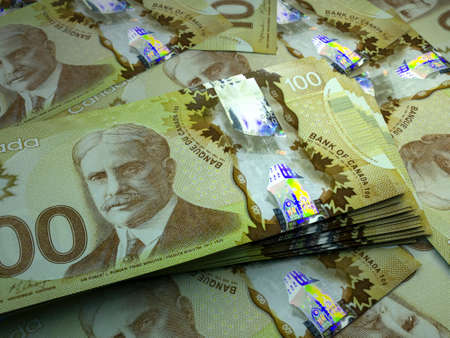 Money of Canada. Canadian dollar bills. CAD banknotes. 100 dollars. Business, finance, news background.の写真素材