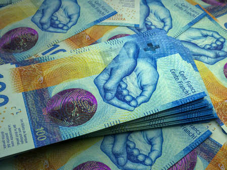 Money of Switzerland. Swiss franc bills. CHF banknotes. 100 francs. Business, finance, news background.の写真素材