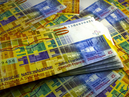Money of Switzerland. Swiss franc bills. CHF banknotes. 10 francs. Business, finance, news background.の写真素材