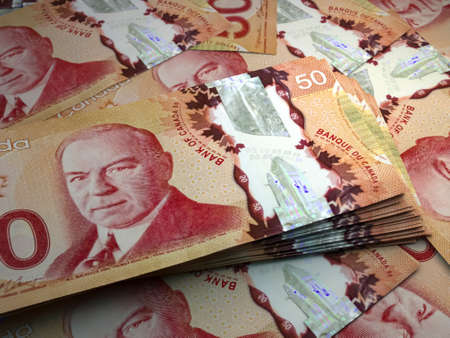 Money of Canada. Canadian dollar bills. CAD banknotes. 50 dollars. Business, finance, news background.の写真素材