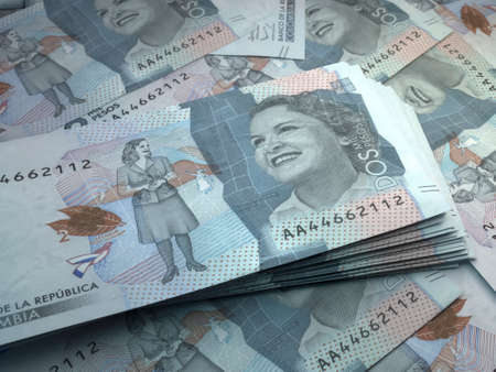 Money of Colombia. Colombian peso bills. COP banknotes. 2 pesos. Business, finance, news background.の写真素材