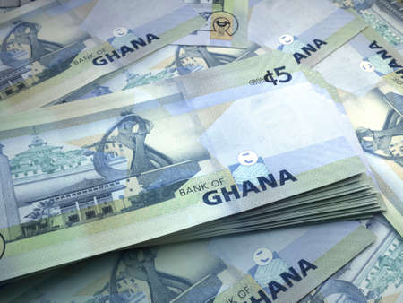 Money of Ghana. Ghanian cedi bills. GHS banknotes. 5 cedis. Business, finance, news background.の写真素材