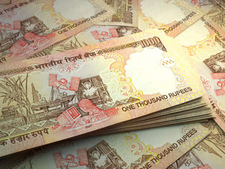 Money of India. Indian rupee bills. INR banknotes. 1000 rupees. Business, finance, news background.の写真素材