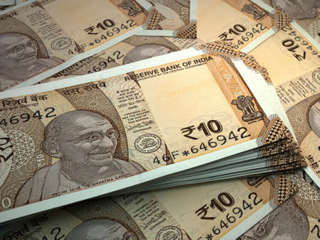 Money of India. Indian rupee bills. INR banknotes. 10 rupees. Business, finance, news background.の写真素材