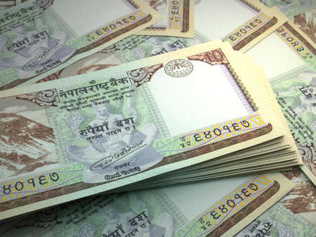 Money of Nepal. Nepalese rupee bills. NPR banknotes. 10 Rs. Business, finance, news background.の写真素材