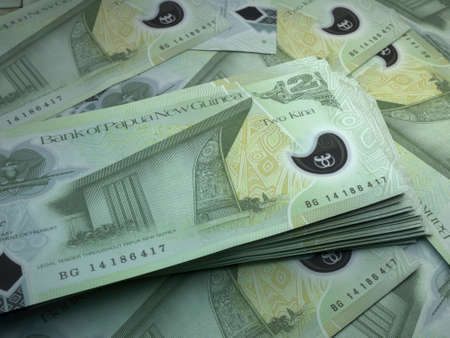 Money of Papua New Guinea. Papua New Guinean kina bills. PGK banknotes. 2 kina. Business, finance, news background.の写真素材