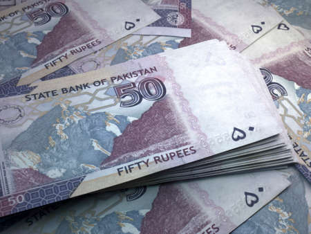 Money of Pakistan. Pakistani rupee bills. PKR banknotes. 50 rupees. Business, finance, news background.の写真素材