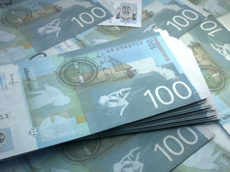Money of Serbia. Serbian dinar bills. RSD banknotes. 100 dinari. Business, finance, news background.の写真素材