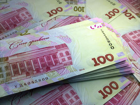 Money of Ukraine. Ukrainian hryvnia bills. UAH banknotes. 100 hryvni. Business, finance, news background.の写真素材