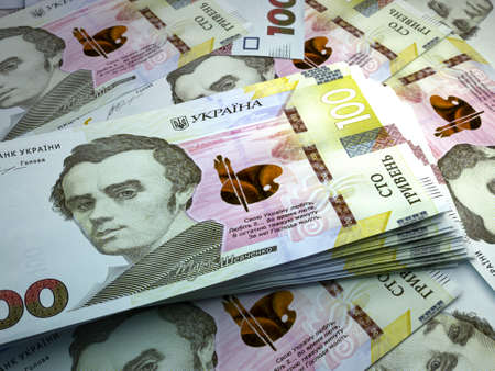 Money of Ukraine. Ukrainian hryvnia bills. UAH banknotes. 100 hryvni. Business, finance, news background.の写真素材