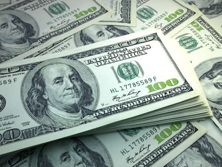 Money of United States. United States dollar bills. USD banknotes. 100 dollars. Business, finance, news background.の写真素材
