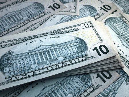 Money of United States. United States dollar bills. USD banknotes. 10 dollars. Business, finance, news background.の写真素材
