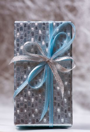 Gift decorated with a tape and a bow